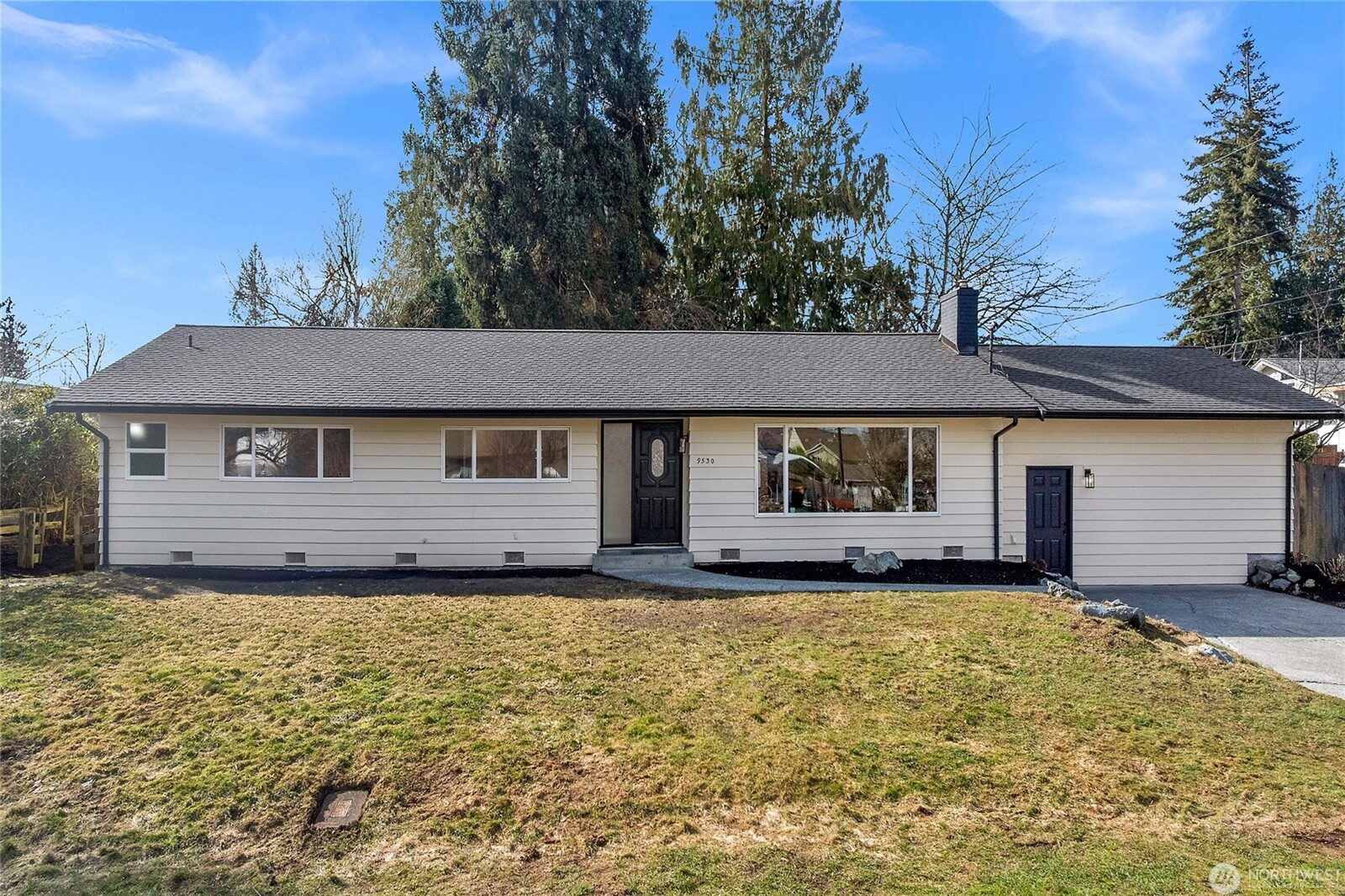 The same Silver Lake home after renovation — new roof, refreshed siding, clean landscaping